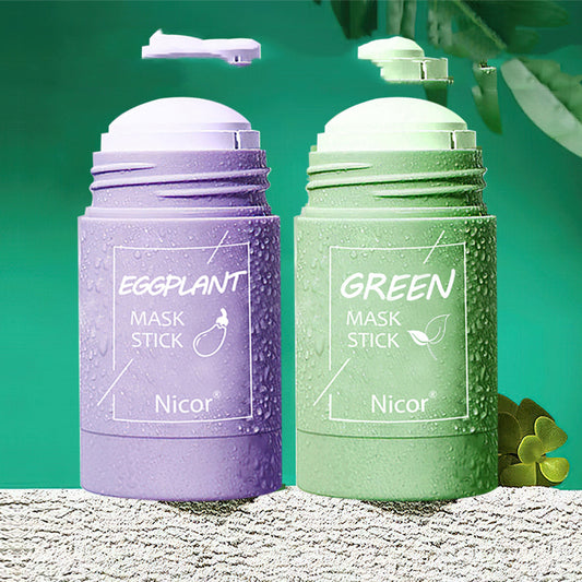 Purple and green mask stick containers with 'Nicor' branding on a textured surface.