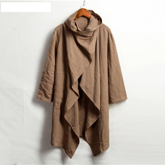 Brown poncho on a wooden hanger against a white background