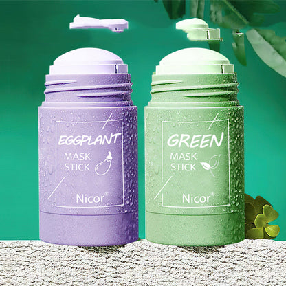 Purple and green mask stick containers with 'Nicor' branding on a textured surface.