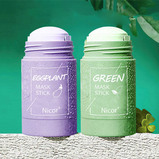 Purple and green mask sticks with 'Nicor' branding on a textured surface with green leaves.