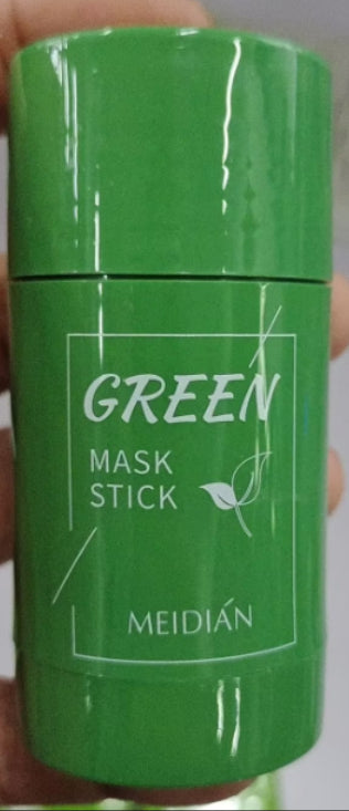 Green mask stick with 'MEIDI®AN' branding held by a hand against a white background