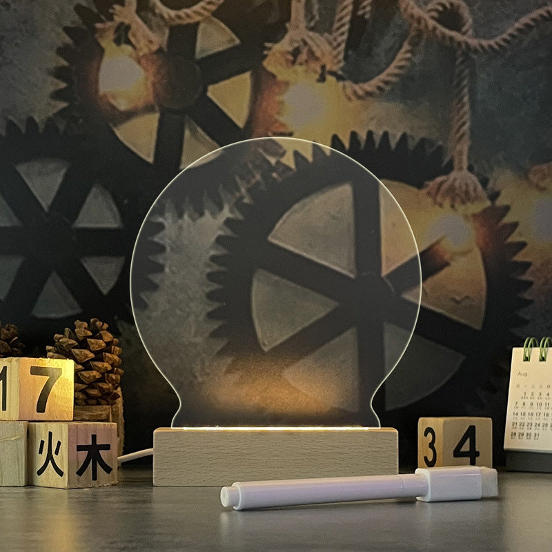Decorative lamp with gear design on a wooden base against a dark background with lights.