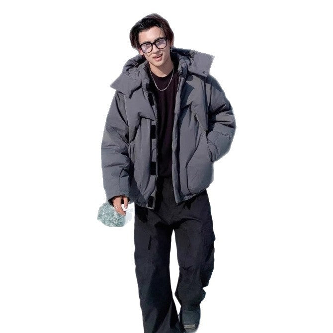 Person wearing a large gray winter coat on a white background
